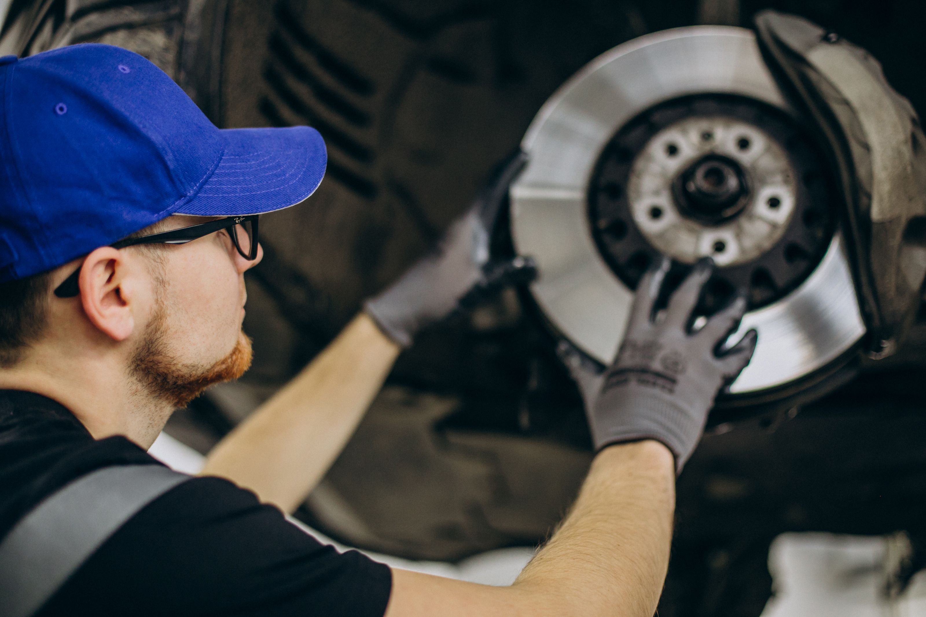 mechanic-changing-brake-discs-car-service.jpg